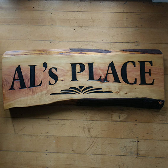Raw Edged Macrocarpa Sign - Al's Place